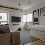 A Studio Apartment With Workspace